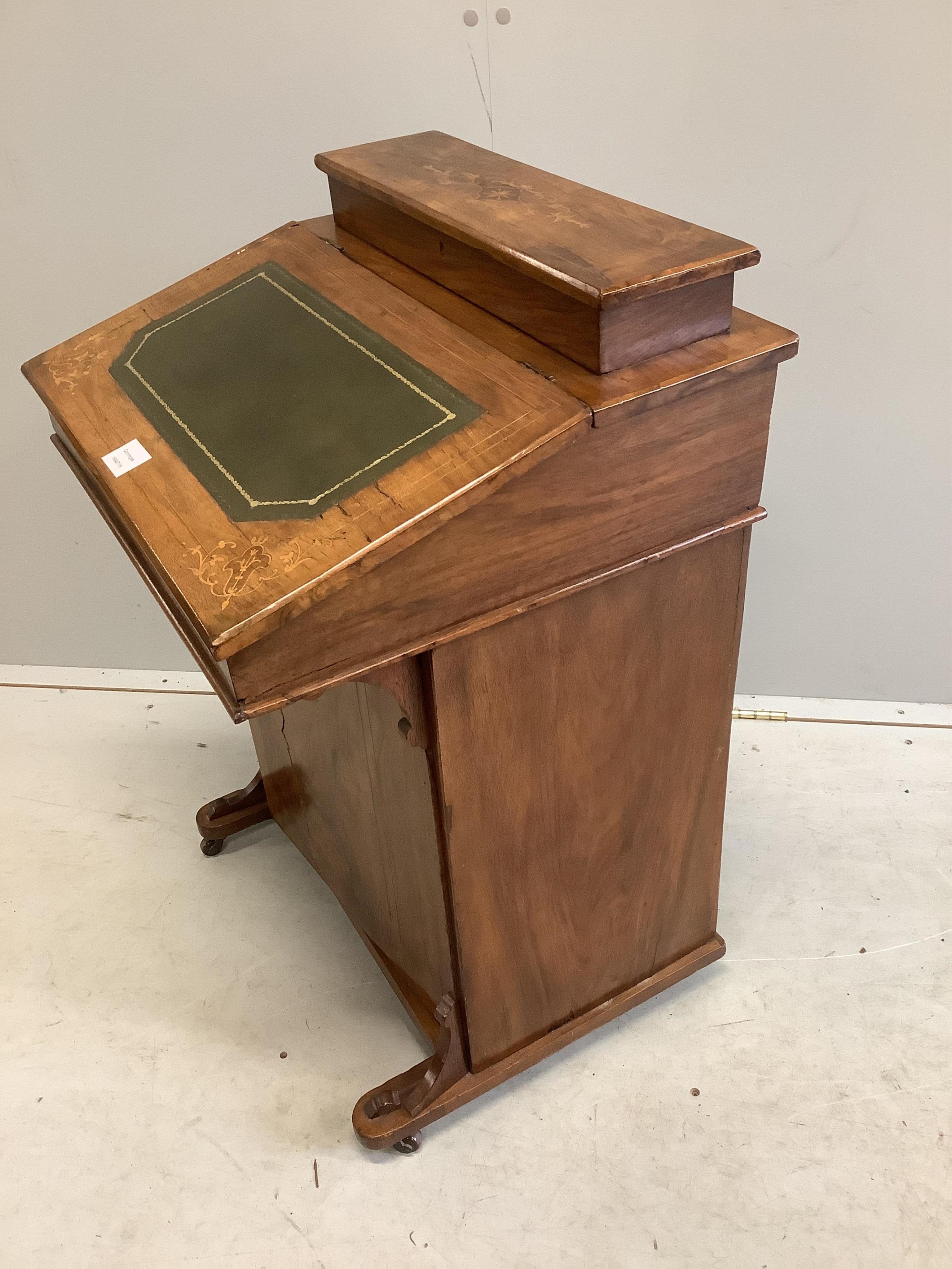 A late Victorian inlaid walnut Davenport, width 53cm, depth 49cm, height 82cm. Condition - poor to fair